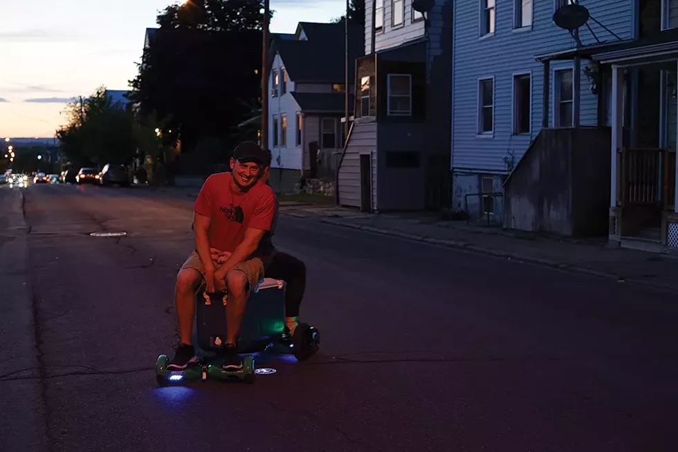 Justin and Brittany Quinones take a night ride on their mobile cooler. - PHOTO: JOHN GARAY