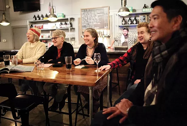 Catskill Merchant Coalition members meet at - Crossroads Brewery and Taproom on Water Street. (Left to right: Chrisie Cordrey of Corduroy Shop, Rodney Greenblat of The Rodney Shop, Kristi Gibson of Magpie Bookshop, Jill Lamanec of the Frisbee Agency, Michael Moy of Joe’s Garage, and Rob Sager of Crossroads behind the bar.) - PHOTO: NIVA DORELL