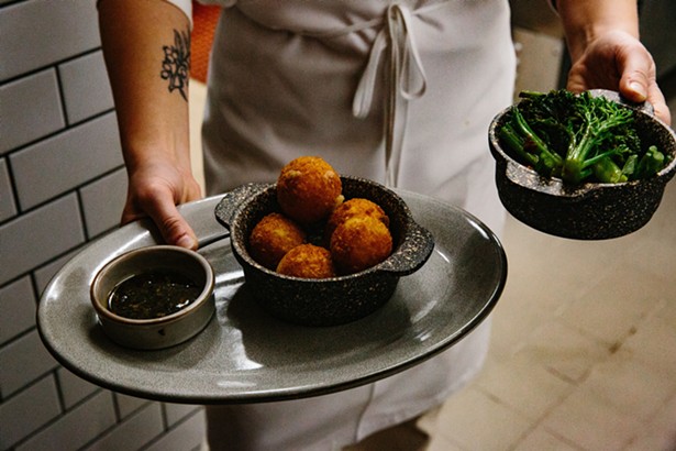 Potato croquettes and broccolini are two of the antipasti offerings at Lola. - LINDSAY TALLEY