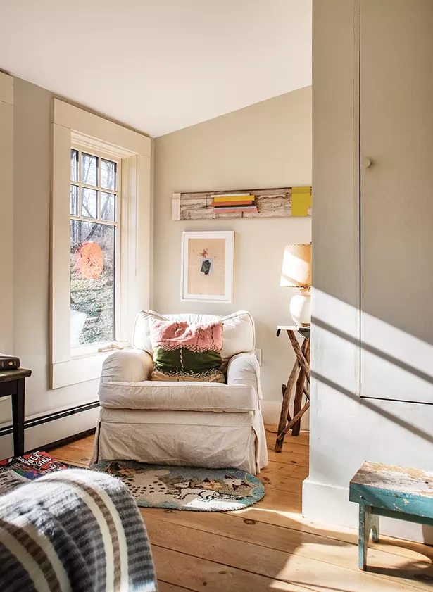 After restoring her studio, Feinberg finally turned her attention to the garage apartment she’d been living in. She fully winterized a wrap-around covered porch to exponentially expand the apartment’s living space. In one corner, what was once used for storage is now a sunny sitting nook, decorated with her art as well as second-hand finds. “My work falls somewhere between painting and object,” she says. - PHOTO: DEBORAH DEGRAFFENREID