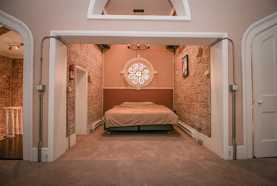 To create a sleeping alcove, Bokaer completely - sealed the former church bell tower twice. “The - first year we entirely sealed the building from mice, and then the next year from bats,” he says. - PHOTO BY SETH DAVIS