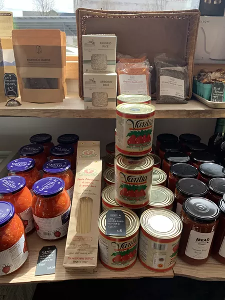 They are also selling packaged and canned items. - VILLAGE COFFEE AND GOODS