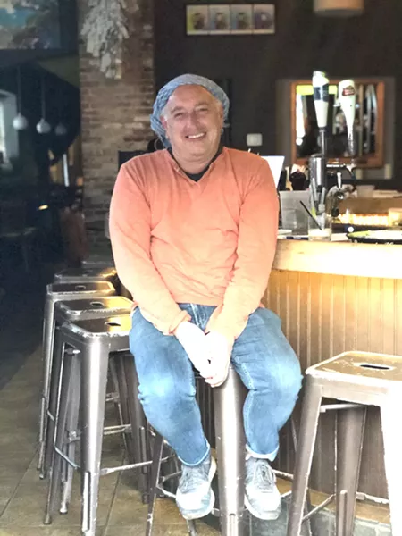 Scott Eckert, manager of “Changes” a men’s clothing store. Scott is now helping out the owners at Gigi Trattoria - AMY WU