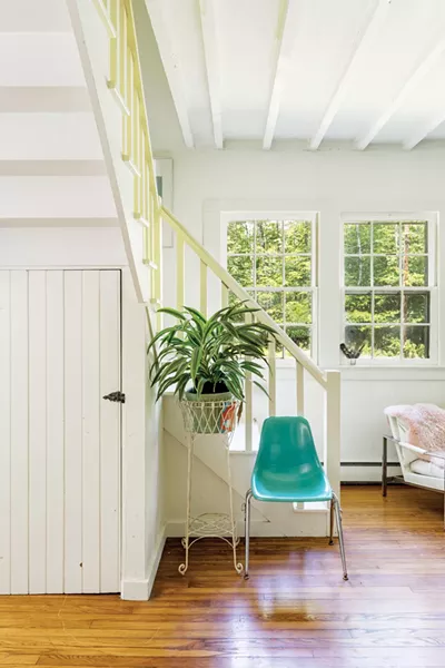 Western light shines brightly into the living space over the peaks of the Catsklls. - PHOTO: WINONA BARTON-BALLENTINE