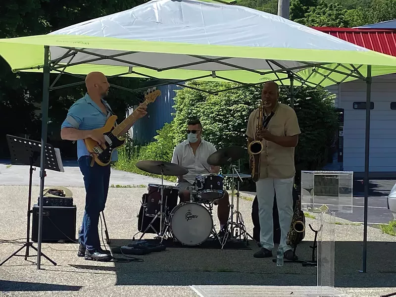 From left: Brian Kastan, Mike Pride, and Eric Person perform a free concert outside Kastan Art Space in Warwick on June 13 - PHOTO: MARIA KASTAN