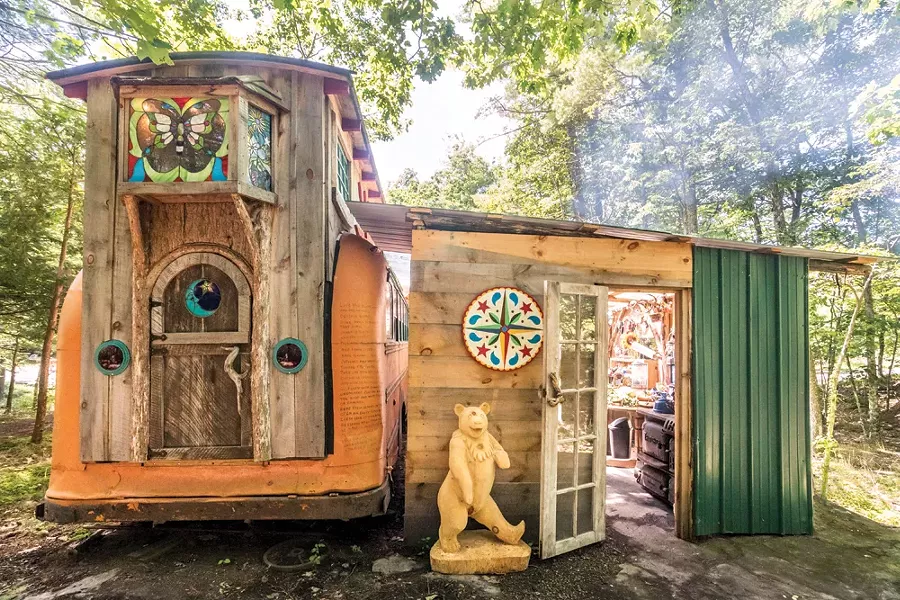 Quick is crafting a separate guest quarters in the style of a European Romani vardo wagon at his on-site wood working studio. Built on a hay wagon chassis, it will eventually have electricity and feature stained glass windows by Cassidy Ryan. - PHOTO BY WINONA BARTON-BALLENTINE