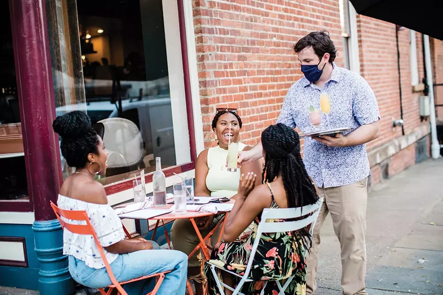 Michael Kelly serving diners outside at Liberty Street Bistro in Newburgh. - MARY KELLY