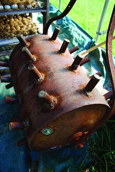 Suzanne Kelly’s prized invention: a dibbler for planting large quantities of garlic seed. - LARRY DECKER