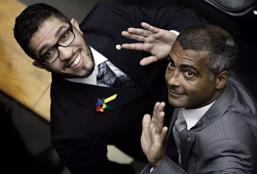 Brazilian Rep. former soccer player Romario (R) and Congressman Jean Wyllys wave during the inauguration ceremony in Brasilia in 2011. - REUTERS/UESLEI MARCELINO