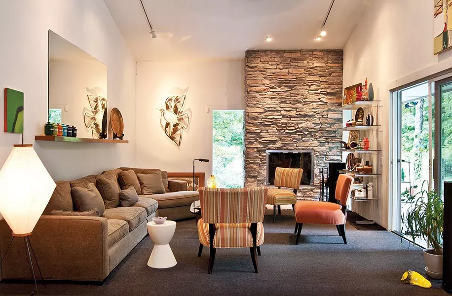 The large, airy living room has ample seating for guests. Along with inviting friends over for dinner Aronson loves to host game nights. "Cards Against Humanity" has become a favorite. - DEBORAH DEGRAFFENRIED
