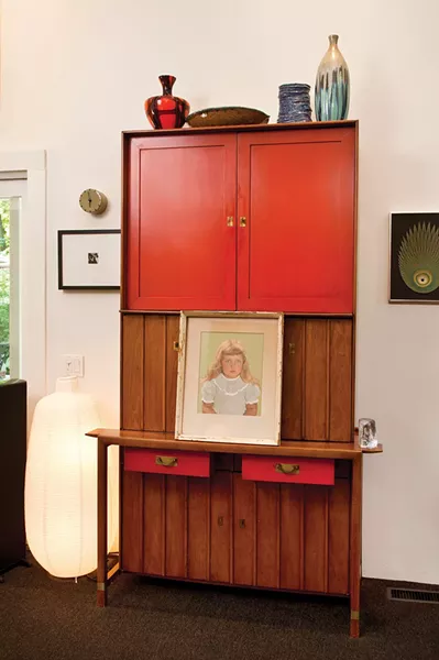 Since I do so much entertaining, most of my furniture has to do double duty. This antique secretary doubles as a liquor cabinet and bar. - DEBORAH DEGRAFFENRIED