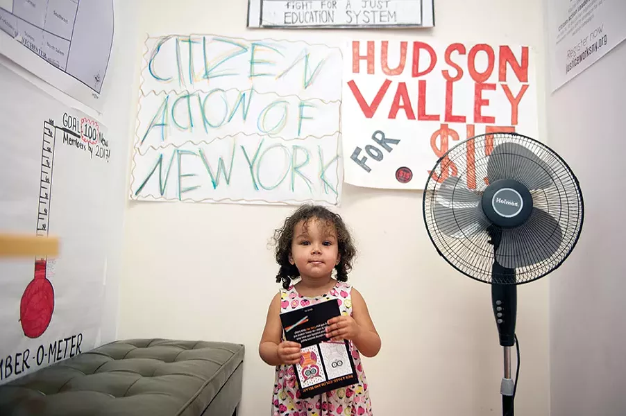Callie Jayne's younger daughter Althea in the kids' area at the Citizen's Action office in Kingston. - HILLARY HARVEY