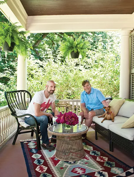 Douglas Sexton, Danny O'Connell, and their dog Dean on their front porch. "We're friends with everyone on the street," O'Connell says. Sexton agrees. "People come over and hang out. It really has become a what we wanted it to be—a gathering spot for friends and family." Even the neighbor's chickens regularly come to visit. - DEBORAH DEGRAFFENREID