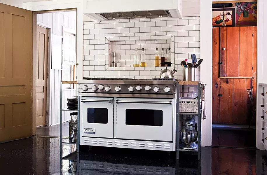 The home's renovated main kitchen. O'Connell did much of the home's tile work. - DEBORAH DEGRAFFENREID