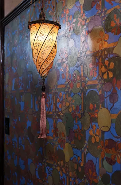 A wall in the home's entranceway. The artist Thomas Donahue hand painted murals throughout the house. - DEBORAH DEGRAFFENREID