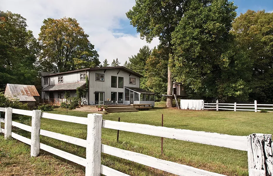 Nadine's two-story living room. "When I first saw this space, I thought—it's perfect for a boom," she says. Recent episodes of "Nirmala's Spice World" have been filmed here and she hopes to feature Hudson Valley farmers and artisans on her show. - DEBORAH DEGRAFFENREID