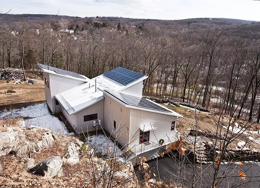 Situated on a south-facing slope, the home was built to take full advantage of seasonal light and is powered by solar panels. A geothermal heating and cooling system regulates the home's temperature throughout the year. - DEBORAH DEGRAFFENREID