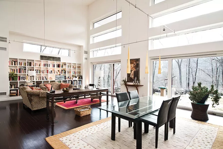 The living room’s triple-paned windows offer dynamic views of Bellvale Mountain and the rolling landscape of the Warwick Valley. “It’s always beautiful and changes so completely, depending on the weather and the time of day. The mountain disappears behind the greenery, and in the fall it reappears. In the summer it’s like a leaf curtain.” - DEBORAH DEGRAFFENREID