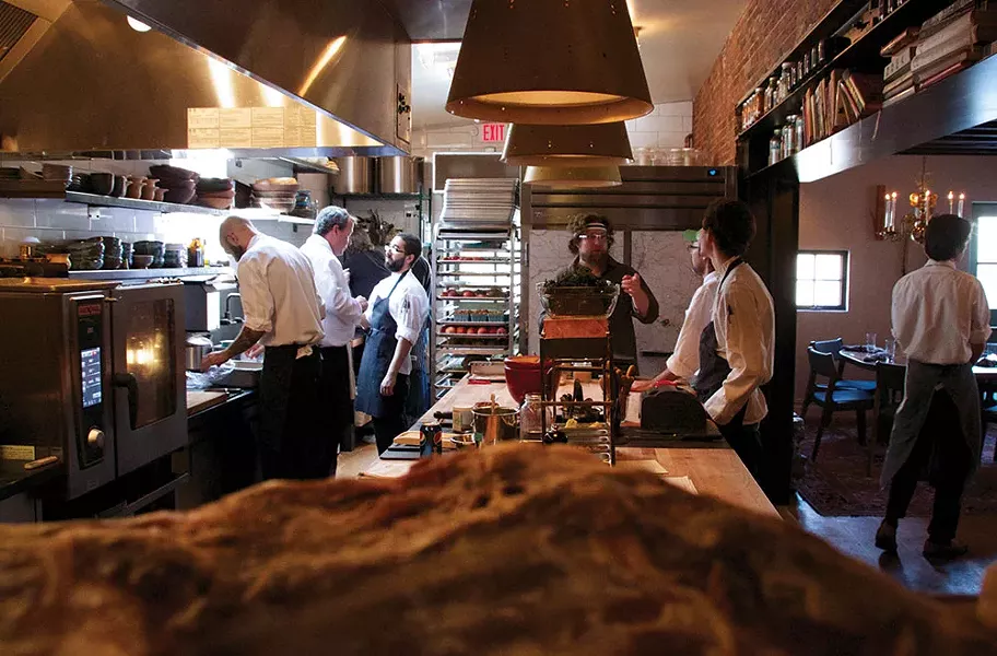 Pelaccio and crew in the Fish & Game kitchen. - PETER BARRETT