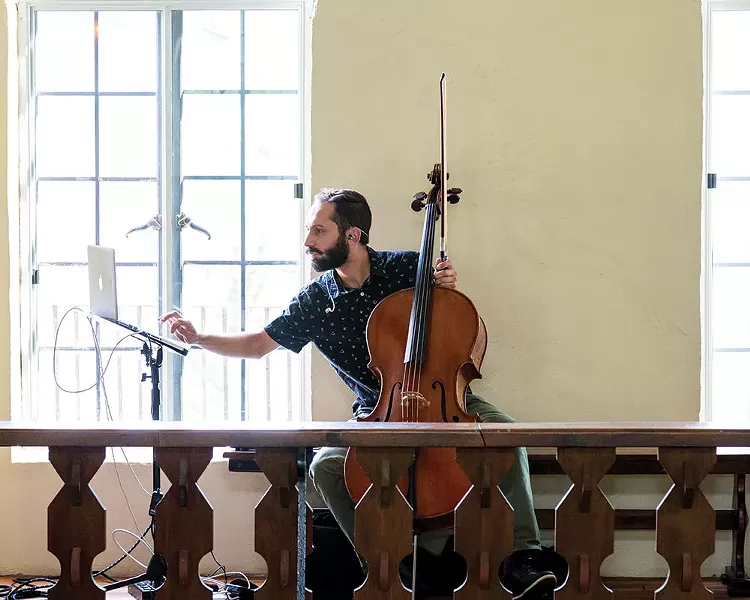 Cellist Daniel Frankhuizen performing at Colony Woodstock during the opening social hour. - RICHARD A. SMITH