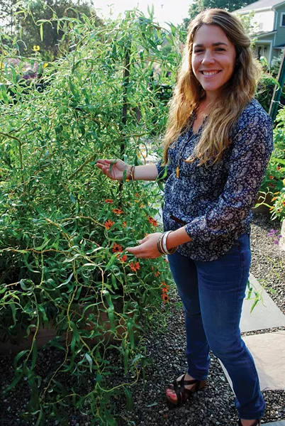 Liz Elkin demonstrates how easy it is to propagate curly willow. - LARRY DECKER