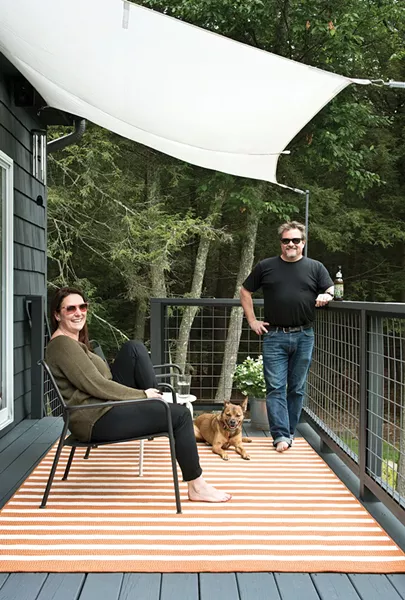 The whole family gathered on the back deck. Decorated with simple awnings and a beer garden table, it’s a popular summer spot. A high powered telescope—a wedding gift from Stenger’s office—helps them take advantage of the dark, upstate nights and keeps them starry-eyed all year long. - DEBORAH DEGRAFFENREID