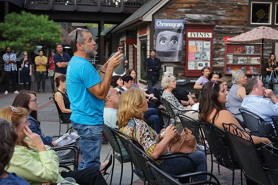 David Brownstein, Executive Director of Wild Earth, addressing a question to the panel about traffic congestion in New Paltz. - JOHN GARAY