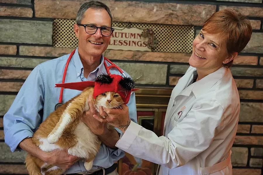 Doctors Jerry Scheck and Kim Buchanan with Oliver at Hopewell Animal Hospital. - JOHN GARAY