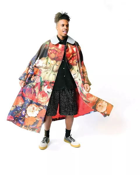 Lexington wears an Arcimbaldo Twill Coat, Sequins Top and Shorts, and Crepe Sole Trainers, all from the Comme des Garçons Homme Plus Spring/Summer 2018 collection, available at Kasuri in Hudson.