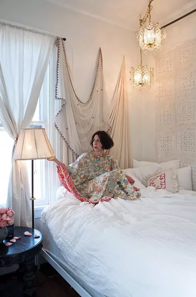 Khorramian in her downstairs bedroom wearing another of her silk “kaftoons.” - DEBORAH DEGRAFFENREID