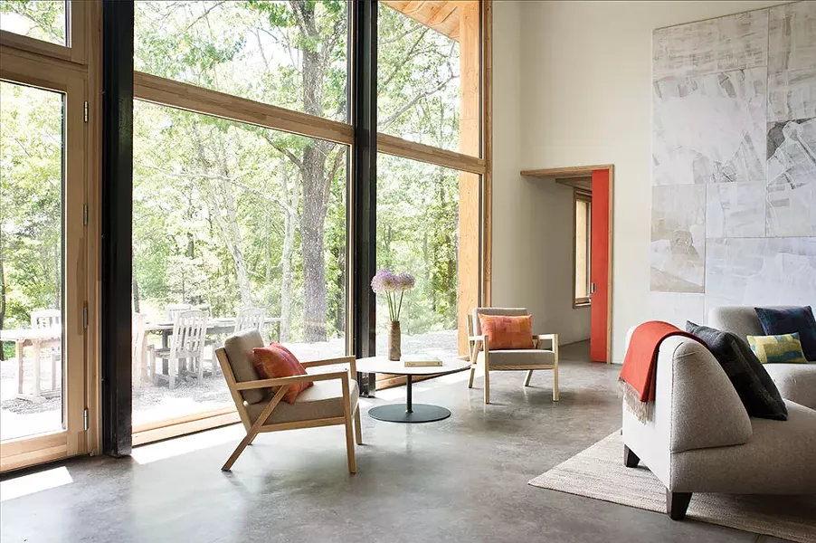 An abundance of south-facing, triple-glazed windows in the double-height living room fills the home with light and capture heat in the winter. They also offer a view of the Shawangunks—bringing the outdoors inside throughout the year. - DEBORAH DEGRAFFENREID
