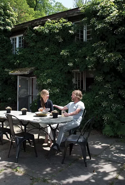 Doornbos and Diani enjoying a Hudson Valley summer day. The outdoor table features a marble top and metal side chairs. - DEBORAH DEGRAFFENREID