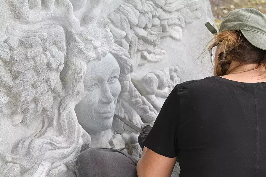 A stone-carving student at the annual Hunter Stone Carving Seminar.