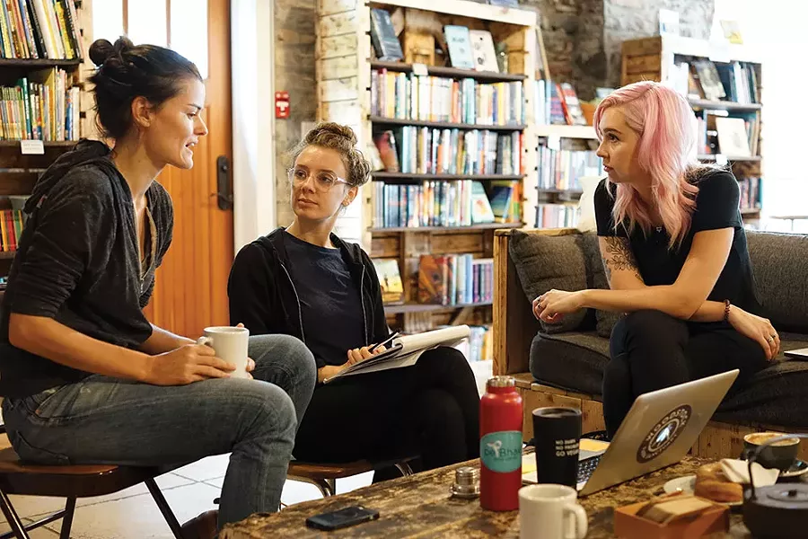 Rachel McCrystal, Lizz DeFeo, and Alexandra Shea of Woodstock Farm Sanctuary, at Rough Draft Bar & Books. - JOHN GARAY