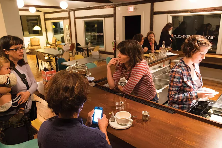 Owner Megan Reynolds talks with customers across the bar.