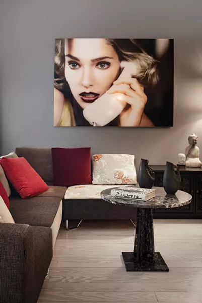 The living room of Gillette’s private quarters. The photo is a blow-up of some of Gillette’s early work. - DEBORAH DEGRAFFENREID