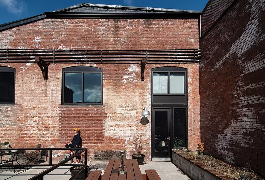 Robin Rice’s loft is one of 200 renovated spaces in The Lofts at Beacon created from a 19th-century textile mill. Right next to the Fishkill Creek’s dam and waterfall, the live/work spaces incorporate many of the original industrial features and enjoy multiple community spaces both indoor and out. - PHOTO: DEBORAH DEGRAFFENREID