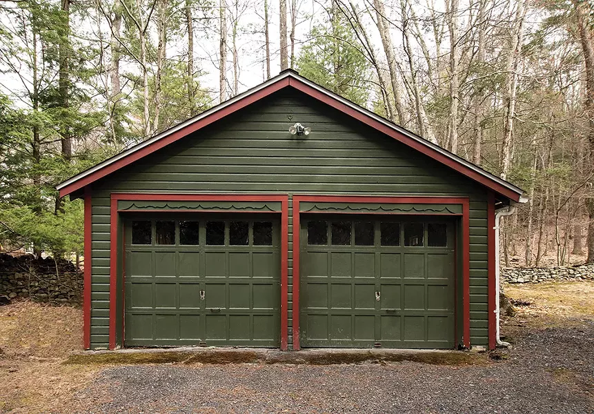 The wooded property includes a storage - space and garage. Her second book Junk: Digging Through America’s Love Affair with Stuff details three years of riding along with junk removal companies all over the country. - PHOTO: DEBORAH DEGRAFFENREID
