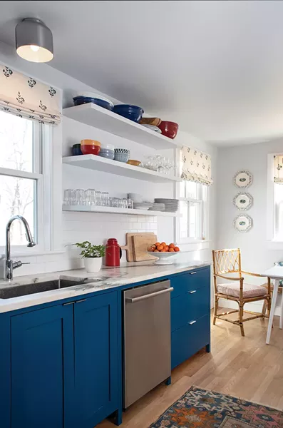 Walker modernized the home’s galley kitchen - adding new appliances, granite counters, and floating shelves. - PHOTO: DEBORAH DEGRAFFENREID