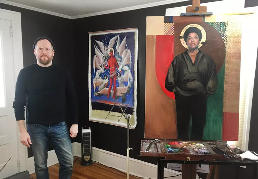 Carl Grauer in his Poughkeepsie, NY studio with his paintings of Audre Lorde (right) & The Ascension of Matthew Shepard (left)