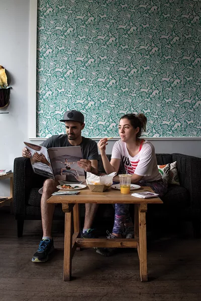 Sandro Figueiredo and Joana Martins enjoying Chronogram and lunch at Conscious Fork. - PHOTO: CHRISTINE ASHBURN