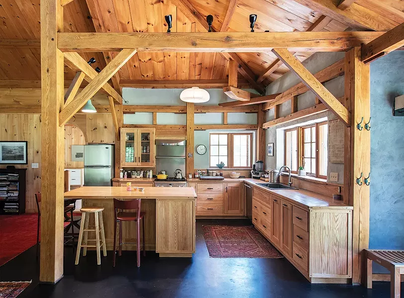 Jeff Gagnon of Rondout Valley Natural Builders helped Duncan design and build the home’s main kitchen. RVNB also helped with the home’s wall finishes, the clay floor, and the bathroom tile. In addition to the main living area and adjacent temple space, the home has a smaller guest kitchen, four bedrooms, and two baths. - PHOTO: DEBORAH DEGRAFFENREID
