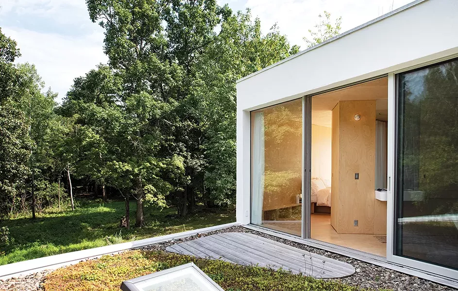 The master suite leads to north- and southfacing roof decks. The couple planted the first-floor roof with a garden. The design adds to the visual appeal as well as insulation. - PHOTO: DEBORAH DEGRAFFENREID