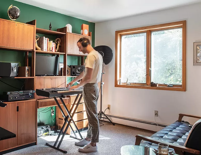 Left: Moser turned the home’s second-floor loft space into a home office. “This is where I spend most of my time mixing music for my work or just focusing on my own stuff,” he says. “It also doubles as a cozy nook when friends come to visit.” - PHOTO: DEBORAH DEGRAFFENREID