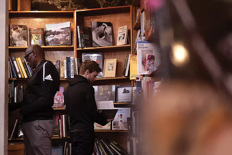 Les Jones and Simeon Tuttle at Inquiring Minds Bookstore. - PHOTO: ROY GUMPEL