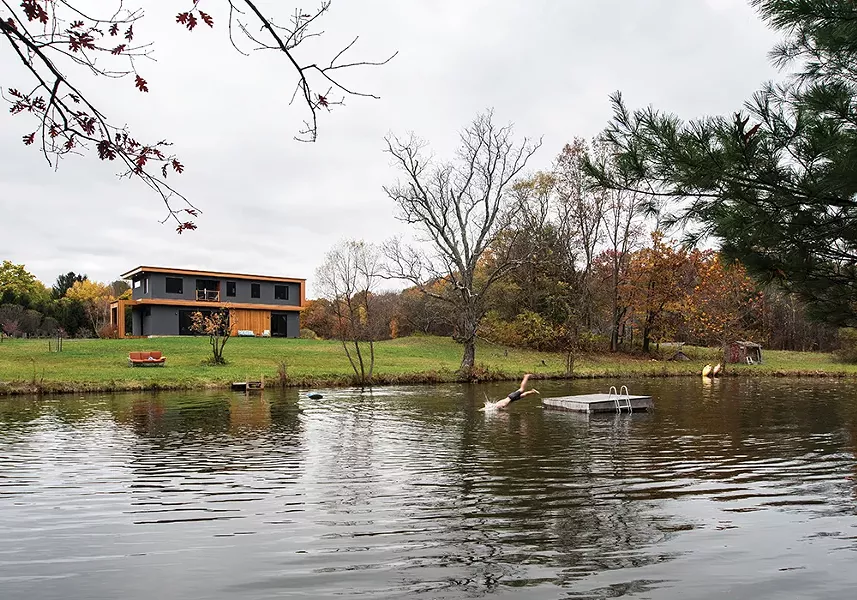 The large pond was the first thing Eric Schmidt noticed about the open seven acres of land that was to become the site of the modernist-inspired home. Built by the previous owner for - his wife, the pond was stocked with koi so the couple could feed them together as they sat by the water’s edge. - PHOTO: DEBORAH DEGRAFFENREID
