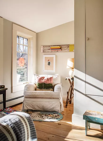 After restoring her studio, Feinberg finally turned her attention to the garage apartment she’d been living in. She fully winterized a wrap-around covered porch to exponentially expand the apartment’s living space. In one corner, what was once used for storage is now a sunny sitting nook, decorated with her art as well as second-hand finds. “My work falls somewhere between painting and object,” she says. - PHOTO: DEBORAH DEGRAFFENREID