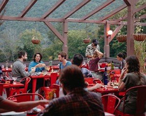 Dining on the deck at Urban Cowboy Lodge, a boutique hotel in the heart of the Catskills with a farm-to-table restaurant helmed by chef Jon Adair.