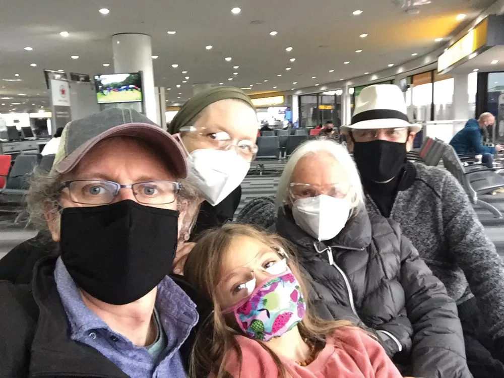 Jennifer May and family in the Newark Airport terminal, on their move to Canada. - PHOTO BY CHRIS METZE