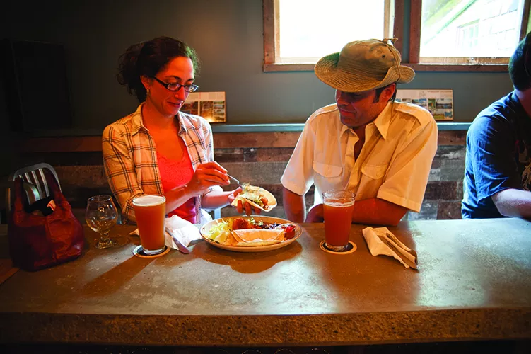 Adele Shulz and Jeremy Backofen eating at the bar. - ROY GUMPEL